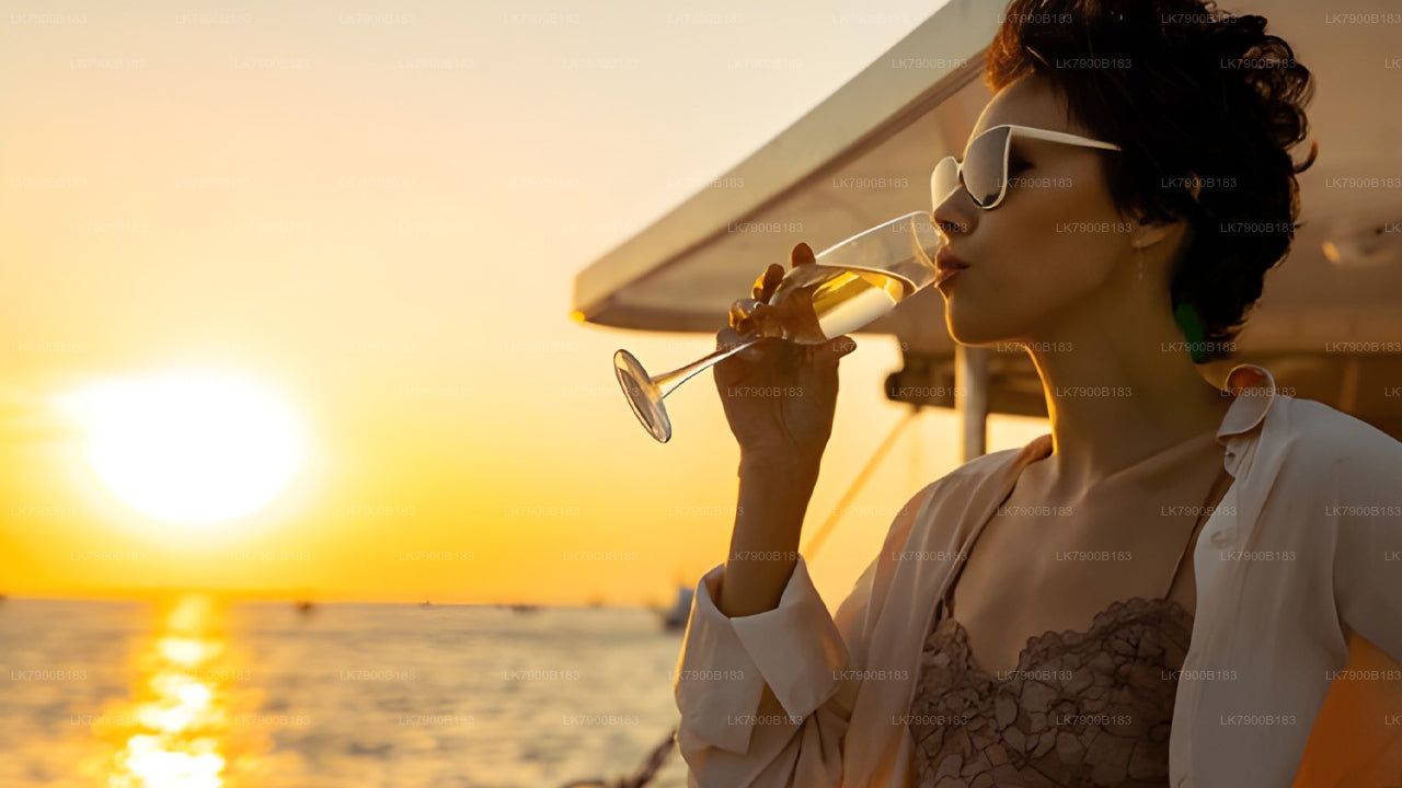 Woman enjoying a drink on a boat at sunset
