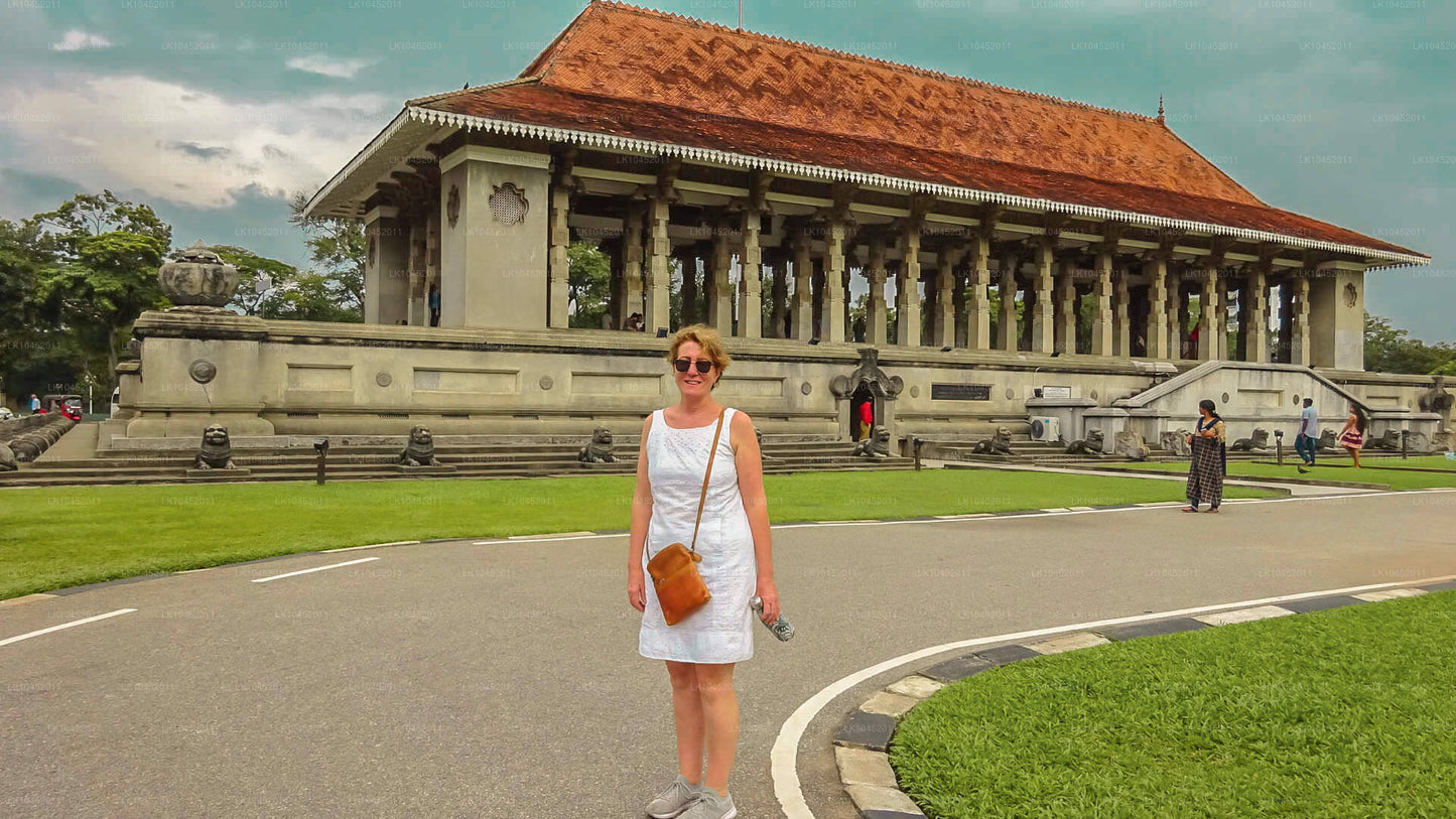 Woman standing in front of the Independence Memorial Hall in Colombo, Sri Lanka.